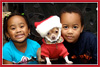 <strong>Jesse L. Henderson III</strong>, LTC (U.S. Army)<br />The kids playing Christmas dress up with Buddy the family pet.